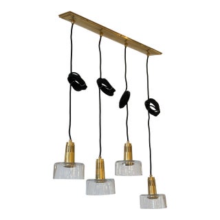 Visual Comfort Iris Quatro Linear Pendant in Hand Rubbed Antique Brass With Clear Glass For Sale