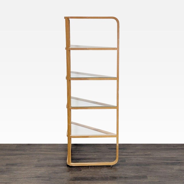 This corner bookshelf features a sturdy wooden frame and four glass shelves, perfect for displaying books or decor. Its...