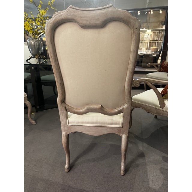 Set of eight matching armchairs by Minton Spidell of Los Angeles. These armchairs feature elegant carved wood frames,...