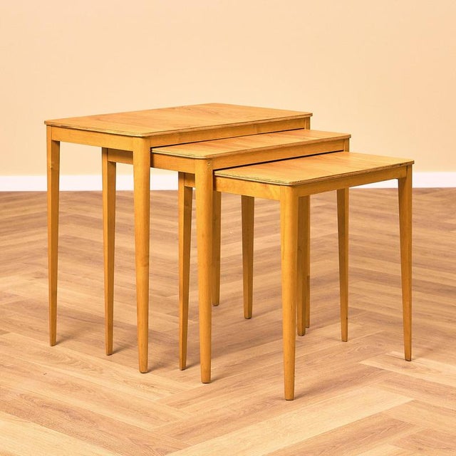 A set of 3 nest of tables manufactured in Sweden in the 1950s-60s. They are made of birch on the legs and birch veneer on...