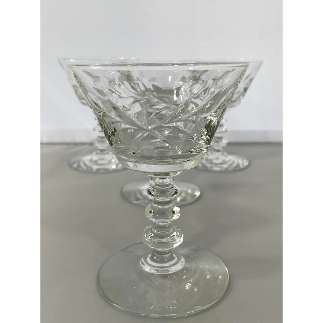 Vintage Victoria pattern coupe stemware by Rock Sharpe (1948). Mid century design features cut leaves on a blown glass...
