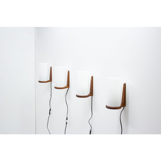 Set of wall sconces designed by the Swedish brothers Uno & Östen Kristiansson for their own company Luxus. Manufactured at...