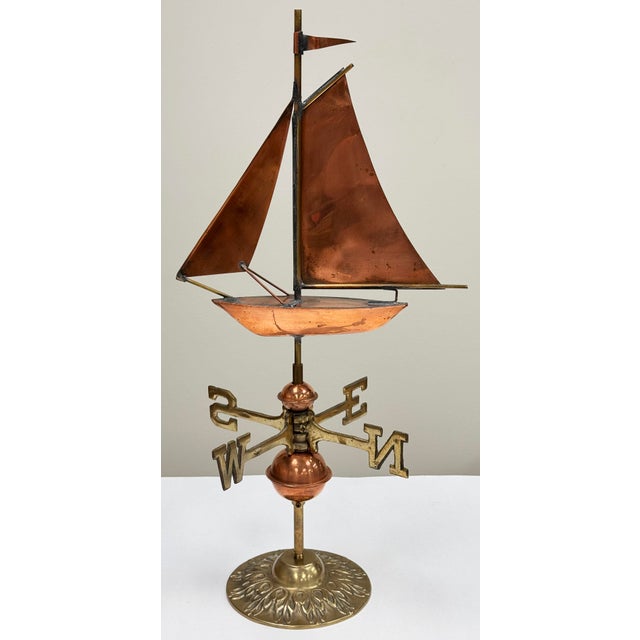 Stunning vintage sailboat motif weathervane with brass base. Mid-late 20th century piece. Perfect for decorating a desk,...