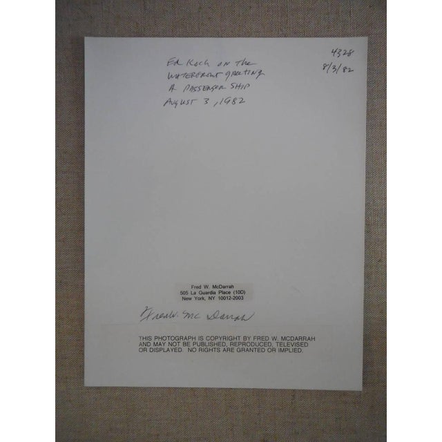 Ed Koch at the waterfront greeting a passenger ship.