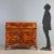 Walnut and walnut burl bureau, featuring curved frames inlaid with various woods, originating from Piacenza and dating...