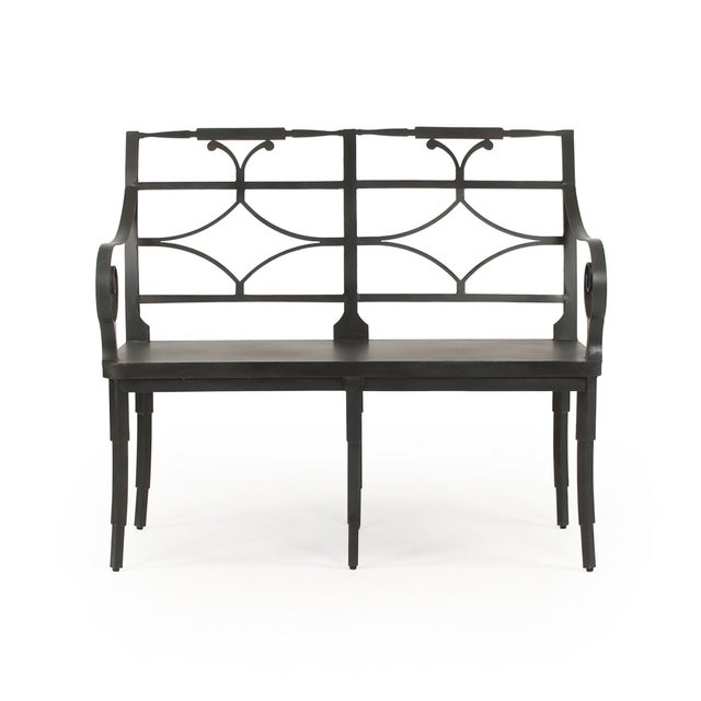The Ranier Metal Bench from Zentique is a Regency-inspired settee bench crafted entirely from iron in an antique black...