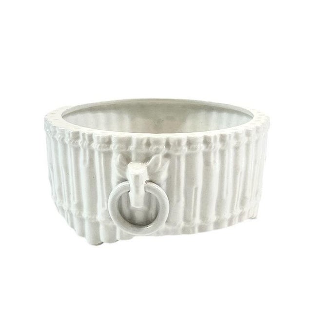 A charming, vintage cache pot by Mottahedeh. Features faux bamboo detailing accented by stylized ring handles to each...