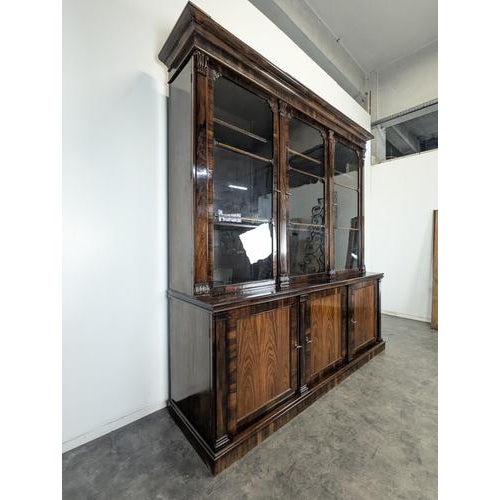 Large English Bookcase in Exotic Wood with Three Glass Doors, in Very Good conditions.