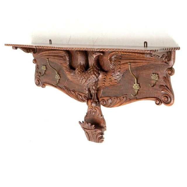 Magnificent and ultra rare Black Forest style wall coat rack. Striking European design from the 1900s. Solid oak frame...