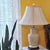 Vintage ivory speckled ceramic table lamp featuring a graceful ginger jar form, glossy glaze, brass-tone fittings, dark...