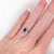 A blue sapphire shines in a rich blue at the centre of this solid 14K yellow gold ring, accented with earth-mined...