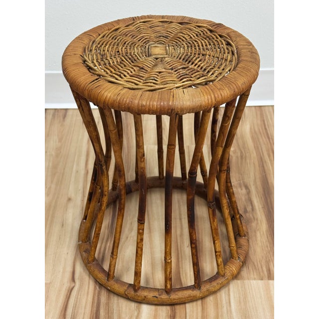Vintage scorched bamboo stool with woven wicker top. Alternative use as a plant stand. Stands at 15.5"H. Base slightly...