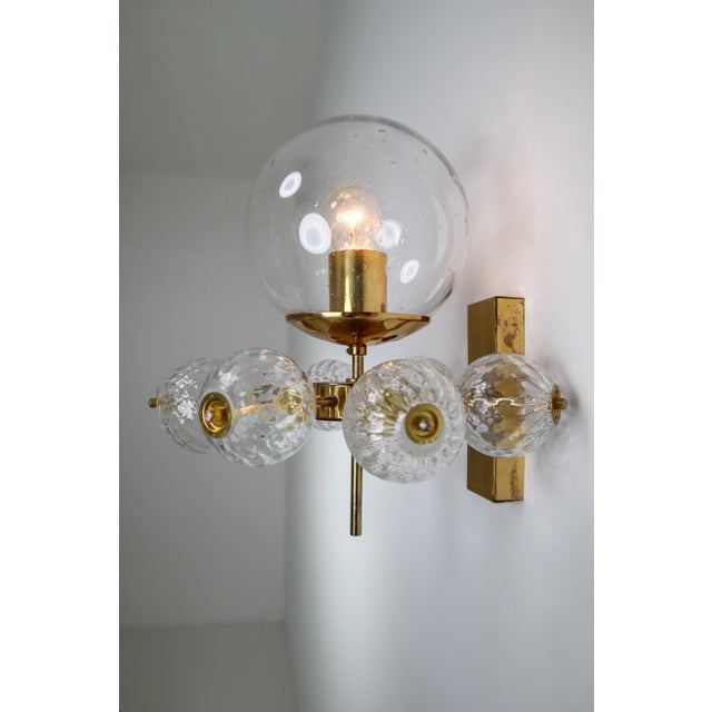 Large set of 20 hotel wall chandeliers with brass fixture and large hand blown glass. The scones are beautifully decorated...