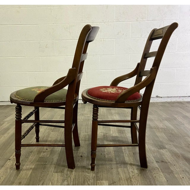 This is a pair of beautiful antique 19th century needlepoint ladderback chairs in a Victorian style. They feature...