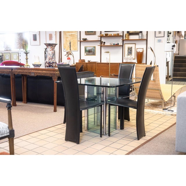 A set of 4 vintage Pietro Costantini tripod chairs. This lovely set of dining chairs have a beautiful Italian design,...