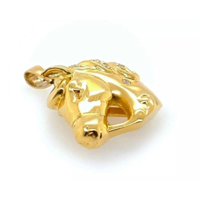 This is a great equestrian piece of jewelry, from 18k yellow gold with a polished finish it features a 3D horse head with...