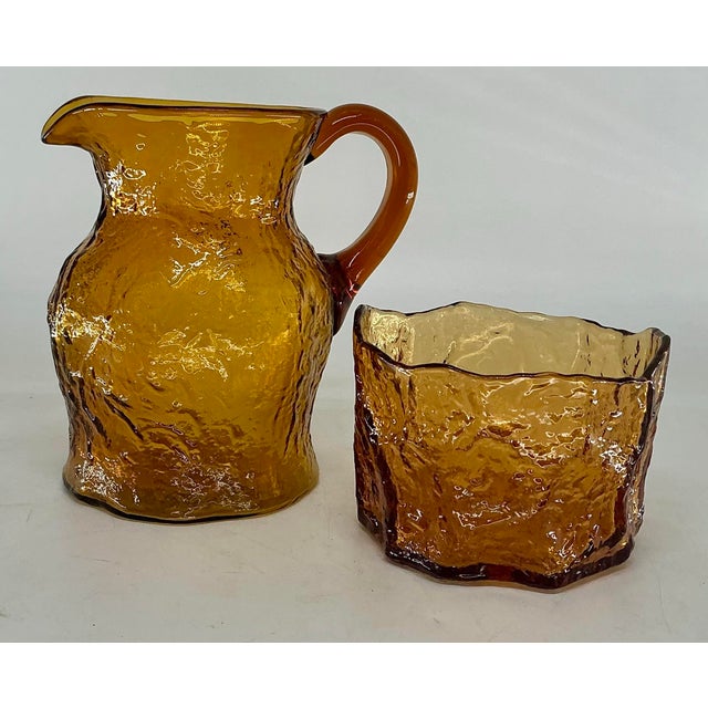 Great “crinkled” glass pitcher and ice bucket in rich amber color. Old new stock -never been used. Set of twelve matching...