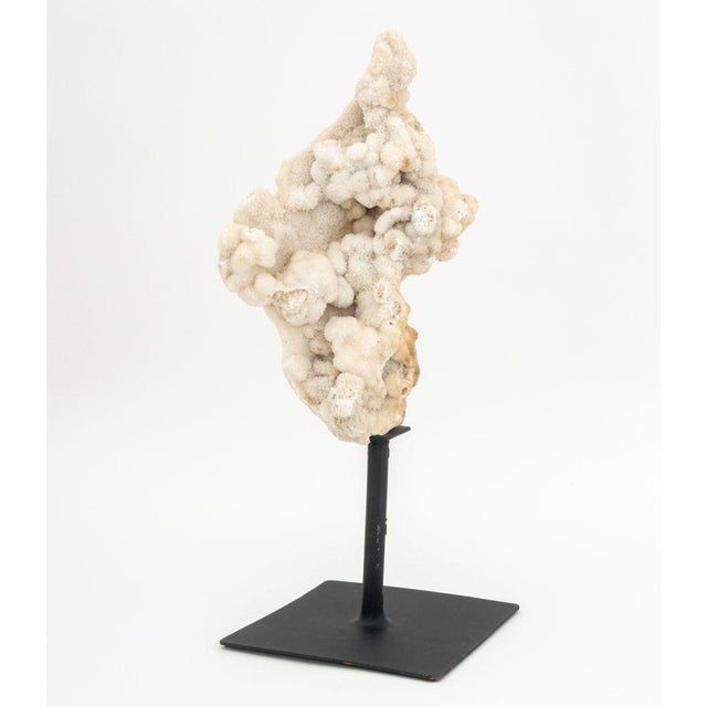 Druzy Quartz Crystal Mineral Specimen, mounted on a black patinated metal stand. Overall: 18.5" H x 10" W x 7" D....