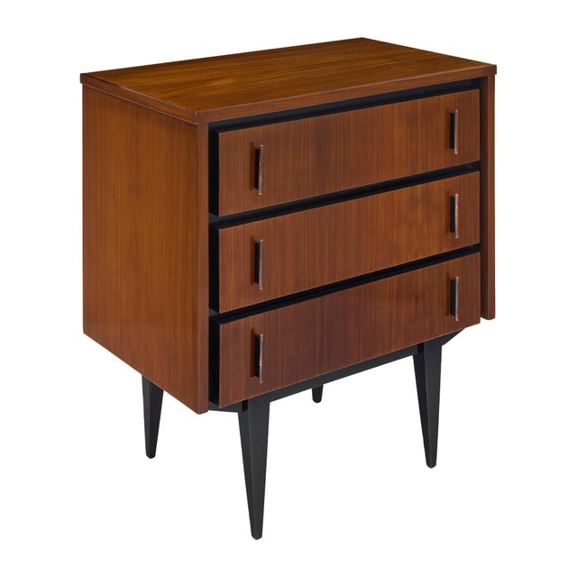 Petite chest of drawers from period mid-century modern France made of solid wood construction, primarily rosewood. The...