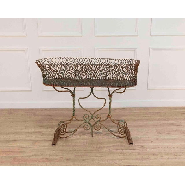 A striking large wrought iron planter dating to the nineteenth century, produced in France during the Napoleon III period....