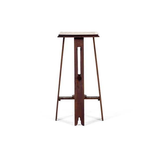 An early 20th century arts and crafts jardiniere stand of square form in mahogany. The top of square form has a moulded...