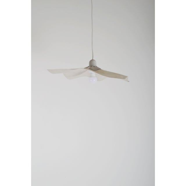 Vintage pendant lamp called 'Area 50' designed by Mario Bellini in the 1970s. This pendant lamp was manufactured by the...