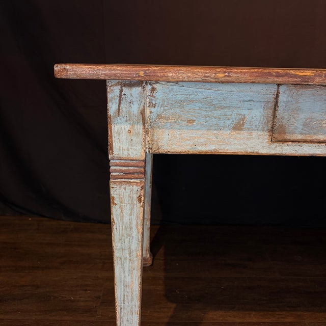 Charming French antique painted table with slender, tapered legs and a single drawer fitted with a simple turned pull. The...