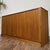 Vintage MCM Danish tambour door credenza or dresser by Hundevad in teak veneer, with a clean, low profile and a grain-...