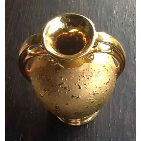 This vintage double-handled pottery piece features a brilliant 22k weeping gold splatter finish that is positively...
