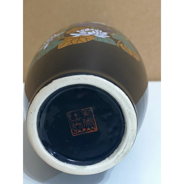 Tall hand painted vase, made in Japan, botanical design with flowers and a bird. It is signed on the bottom and says...