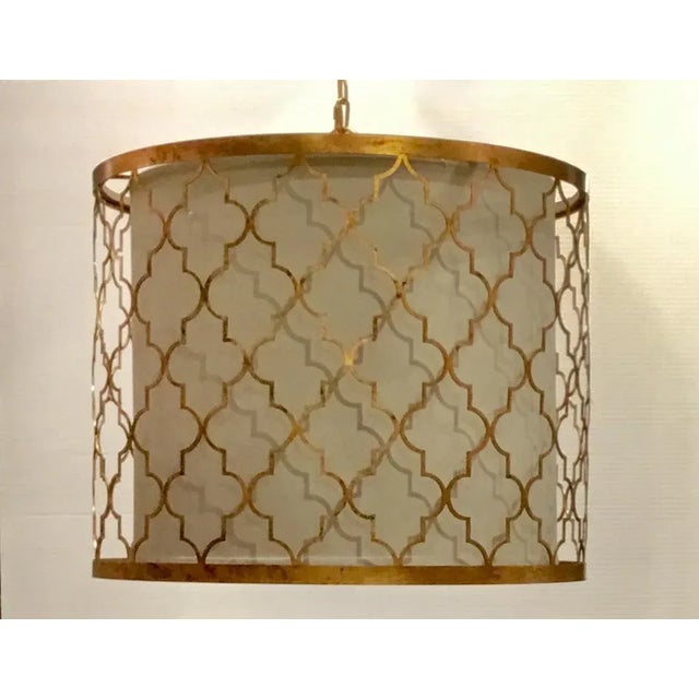 Original Retail $1047, Stylish modern Regina Andrew geometric gold leaf finished pendant, white drum shade and three...