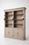 Elegant and timeless library cabinet by Charrell Home Interiors, executed in a refined light oak finish and complete with...
