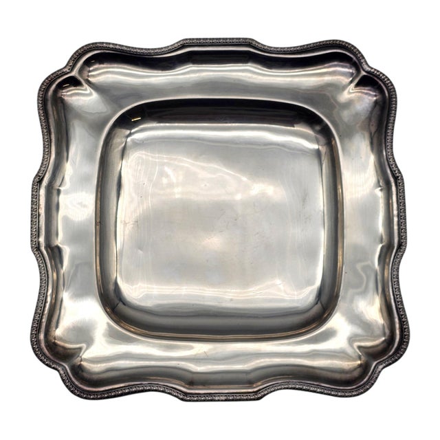 Refined in both proportion and detail, this French-style silverplate serving tray presents a sculptural scalloped form...
