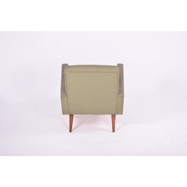 This Portuguese armchair or single sofa is in green nappa, with wooden feet.