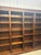 Impressive large-scale library bookcase crafted from solid elm wood, featuring a timeless architectural design with...
