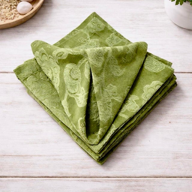 Set of eight Pottery Barn jacquard cloth napkins in a rich green botanical pattern, ideal for elevated dining, seasonal...