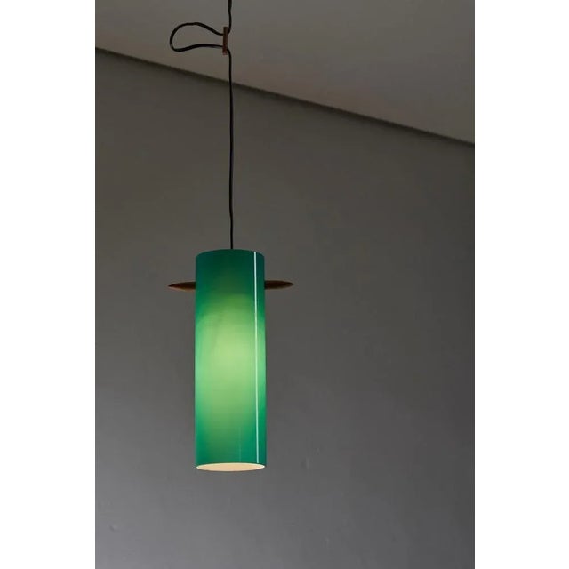 Introducing the Petrol Green Glass Cylinder pendant by Luxus, a stunning and unique lighting piece that effortlessly...