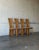 Curved slatted backrests extend down to the floor on this striking set of four dining chairs. Highback silhouettes create...