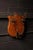 Victorian wall-mounted coat and hat rack featuring a warm-finished oak backboard cut in a heraldic shield form with a...