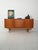 1960s teak sideboard with tiled central drawers and side doors. A 1960s Scandinavian teak sideboard with elegant and well-...