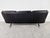 Mid-century three seater sofa designed by Carl Straub in black leather and teak. Beautifully shaped metal base. Good...