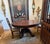 An exceptional Tobey Furniture Company of Chicago round pedestal dining table, bearing the original “TOBEY / Established...
