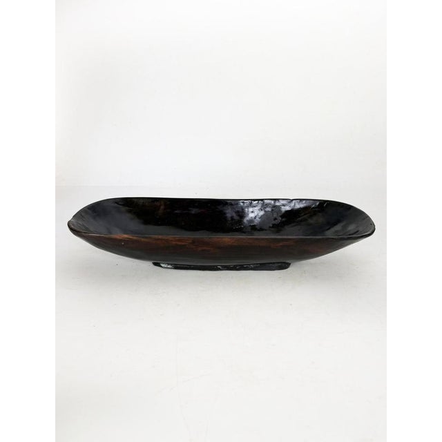 Wooden fruit bowl with an antique patina, France, 1960s, exuding rustic and authentic charm. This large bowl is...