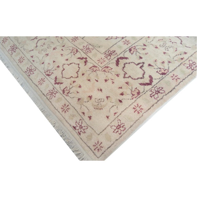 This Beautiful high quality rug from Egypt features the classic Agra tulope design and a masterful color combination. 100%...