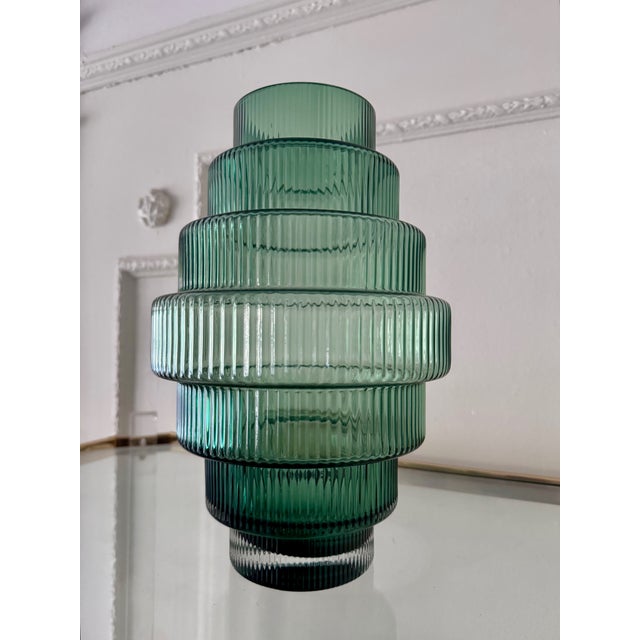 The Steps Vase is a unique, fashionable and eye-catching piece of glassware. The handcrafted, full color mouth-blown glass...