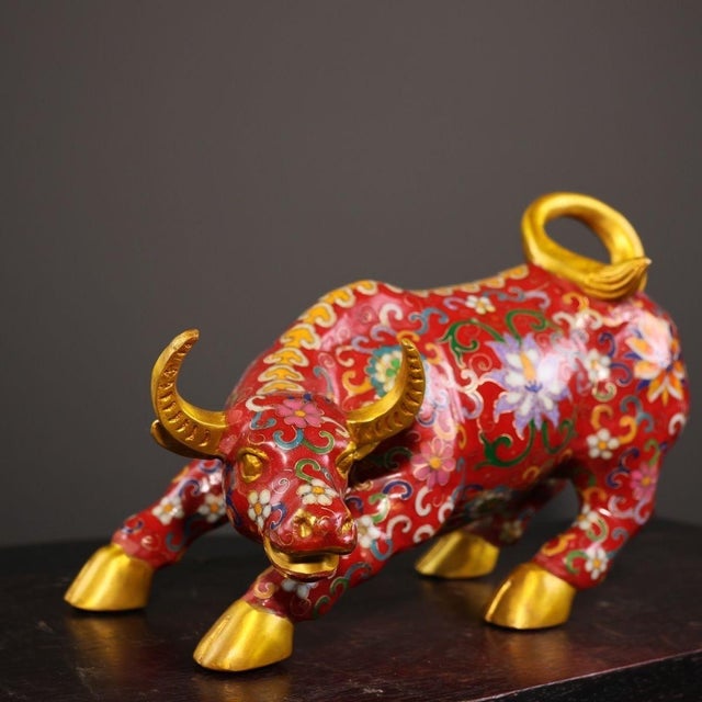 This striking vintage statue depicts a powerful ox, the second animal in the Chinese zodiac, cast in a dynamic, charging...