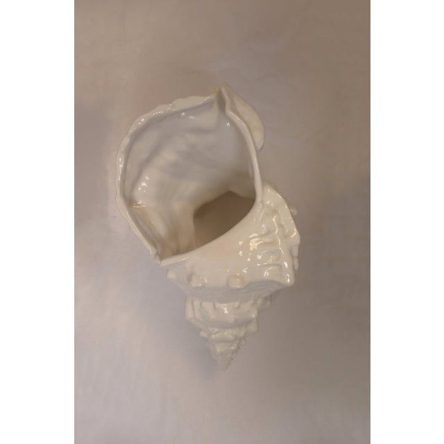 Inspired by the natural curves of ocean shells, this ceramic bowl blends coastal elegance with timeless design. Its...