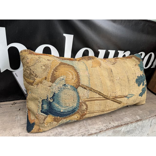 This authentic seventeenth century Flemish tapestry pillow is crafted from a handwoven wool fragment dating to the 1600s....