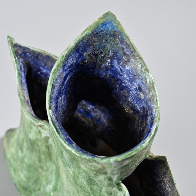 A mixed-clay vase with a wiped glaze, created by Béatrice Cenci. The free and irregular forms evoke a volcanic landscape,...
