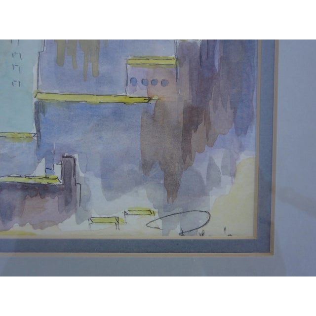 Cityscape watercolor in blues and purples, beautifully framed in gold.